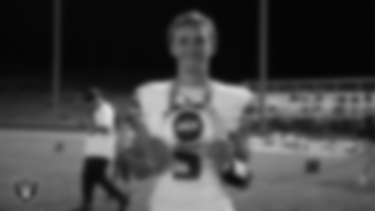Churchill County High School quarterback Matthew B. poses for a photo with the Week 1 MVP chain after the Las Vegas Raiders' Football Showcase game at North Valleys High School.