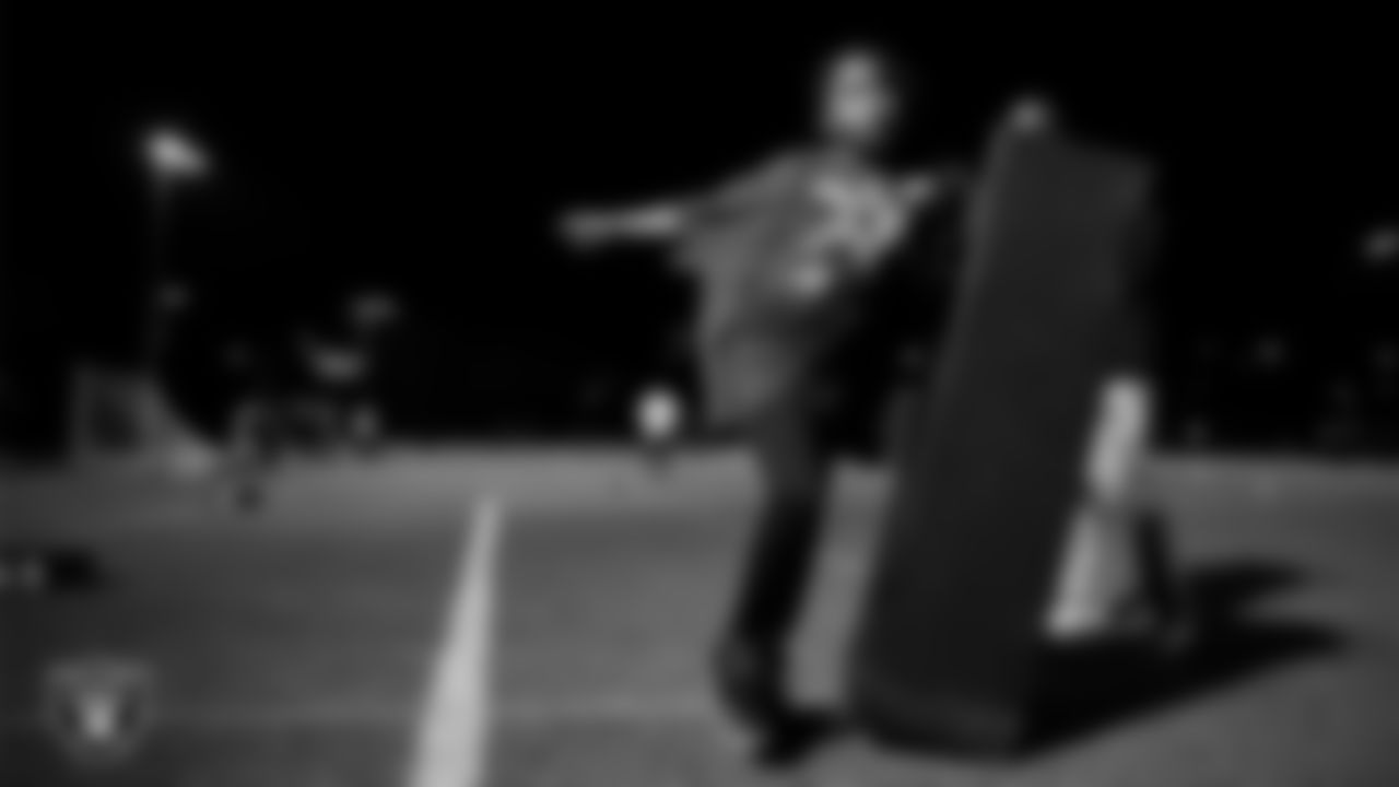 An athlete takes part in a Silver and Black League flag football clinic at Bill and Lillie Heinrich YMCA.
