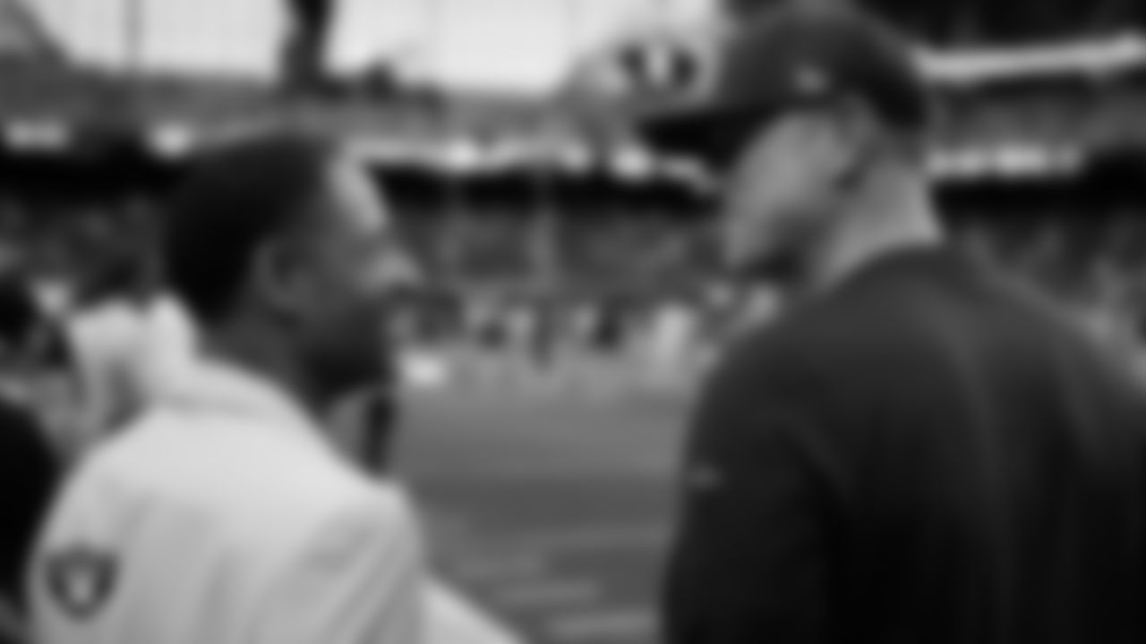 Las Vegas Raiders alumnus Eric Allen talks with General Manager John Spytek before the regular season home game against the Tennessee Titans at Allegiant Stadium.