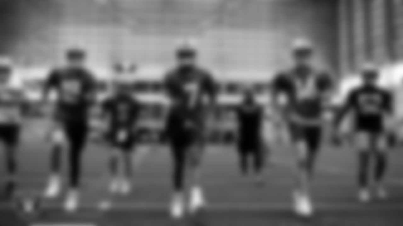 Las Vegas Raiders quarterbacks Aidan O'Connell (12), Cam Miller (5), Geno Smith (7) and Carter Bradley (14) at an Organized Team Activity (OTA) at Intermountain Health Performance Center.