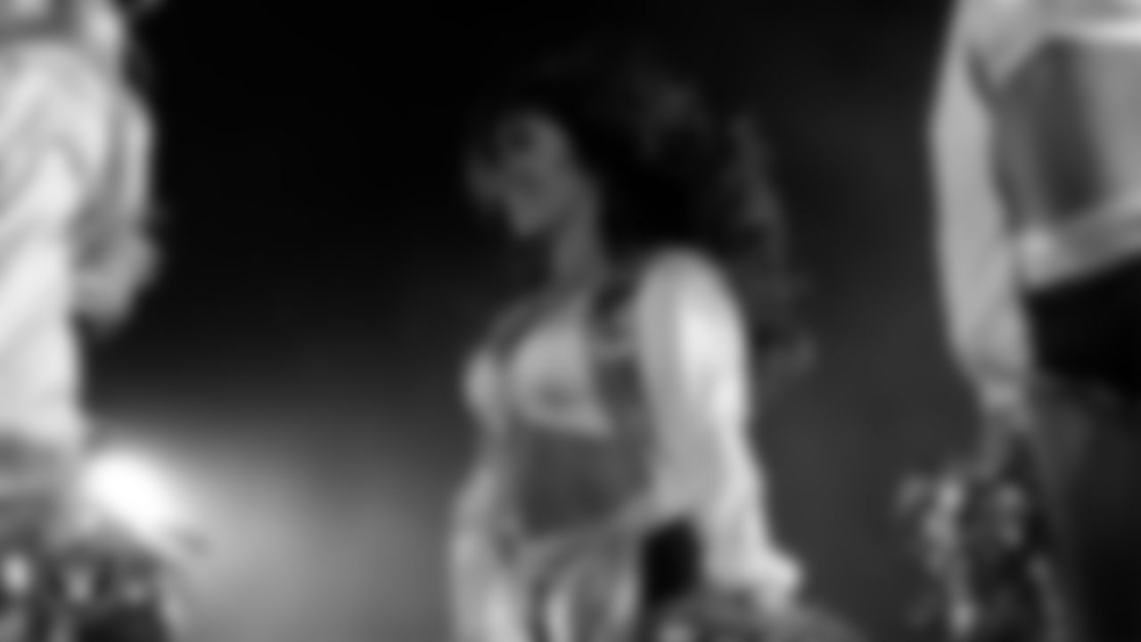 Raiderette Tatiana performs with Rapper Nelly at halftime during the regular season home game against the Dallas Cowboys at Allegiant Stadium.