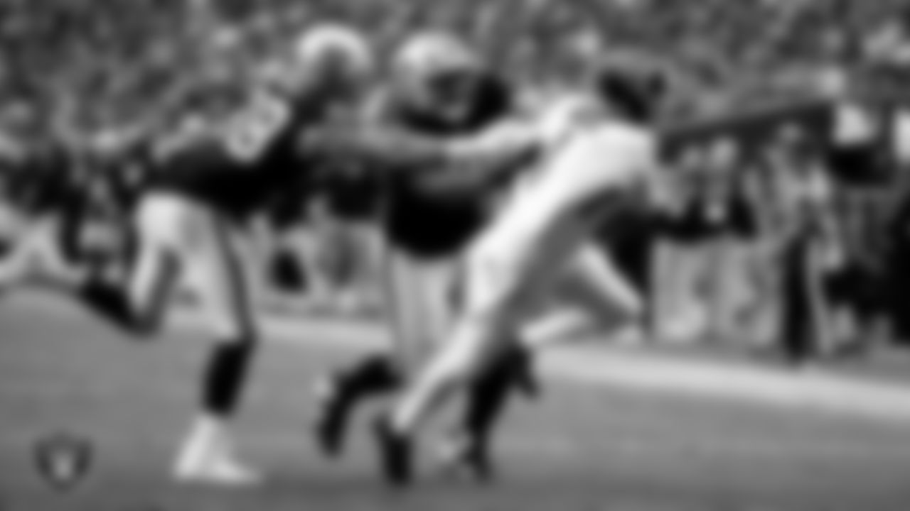 Las Vegas Raiders defensive end Maxx Crosby (98) and defensive tackle Thomas Booker IV (99) during the regular season home game against the Tennessee Titans at Allegiant Stadium.
