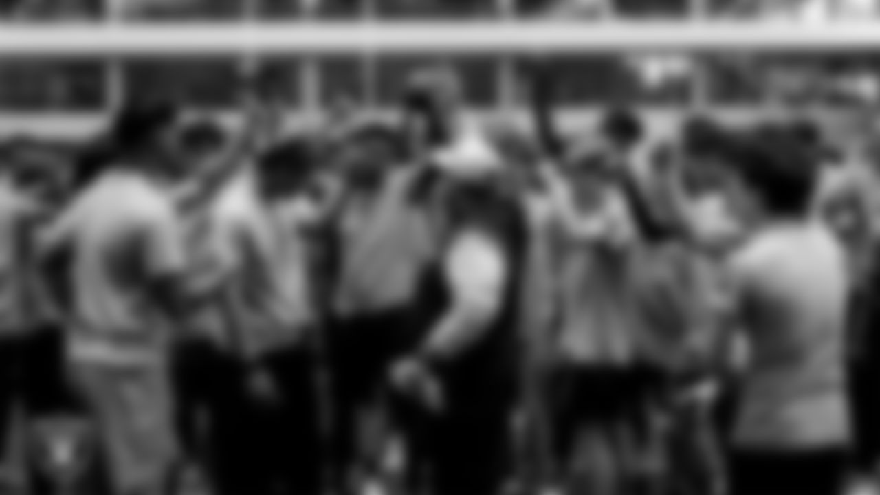 Las Vegas Raiders senior manager of football development Jordan Aguilar huddles with athletes during ELITE Academy at Intermountain Health Performance Center.