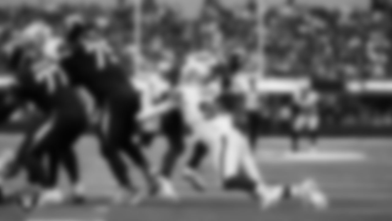 Las Vegas Raiders defensive end Maxx Crosby (98) sacks the quarterback during the regular season away game against the Los Angeles Chargers at SoFi Stadium.