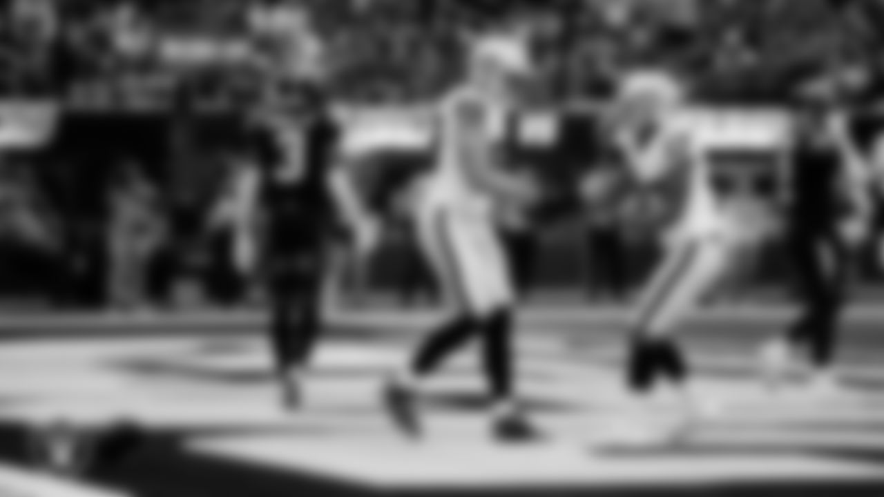 Las Vegas Raiders tight end Brock Bowers (89) celebrates with wide receiver Tyler Lockett (17) after making a 6-yard touchdown catch during the regular season away game against the Los Angeles Chargers at SoFi Stadium.