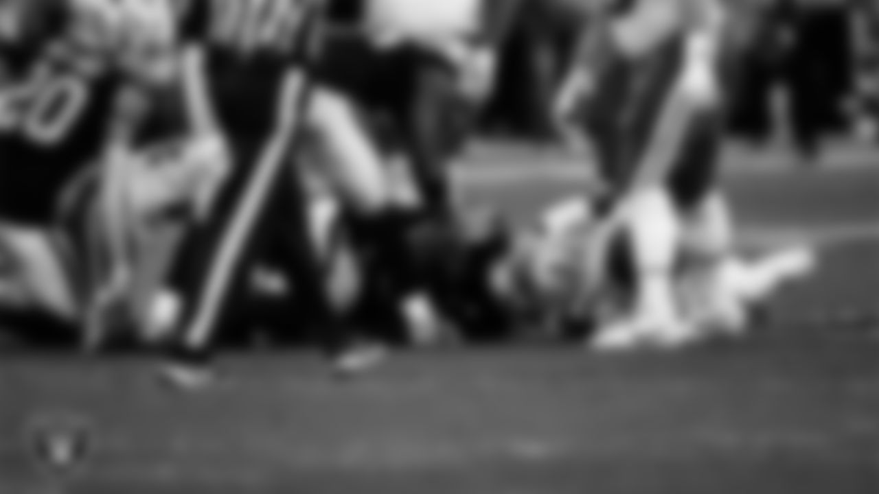 Las Vegas Raiders defensive tackle JJ Pegues (92) recovers a fumble during the regular season home game against the Kansas City Chiefs at Allegiant Stadium.