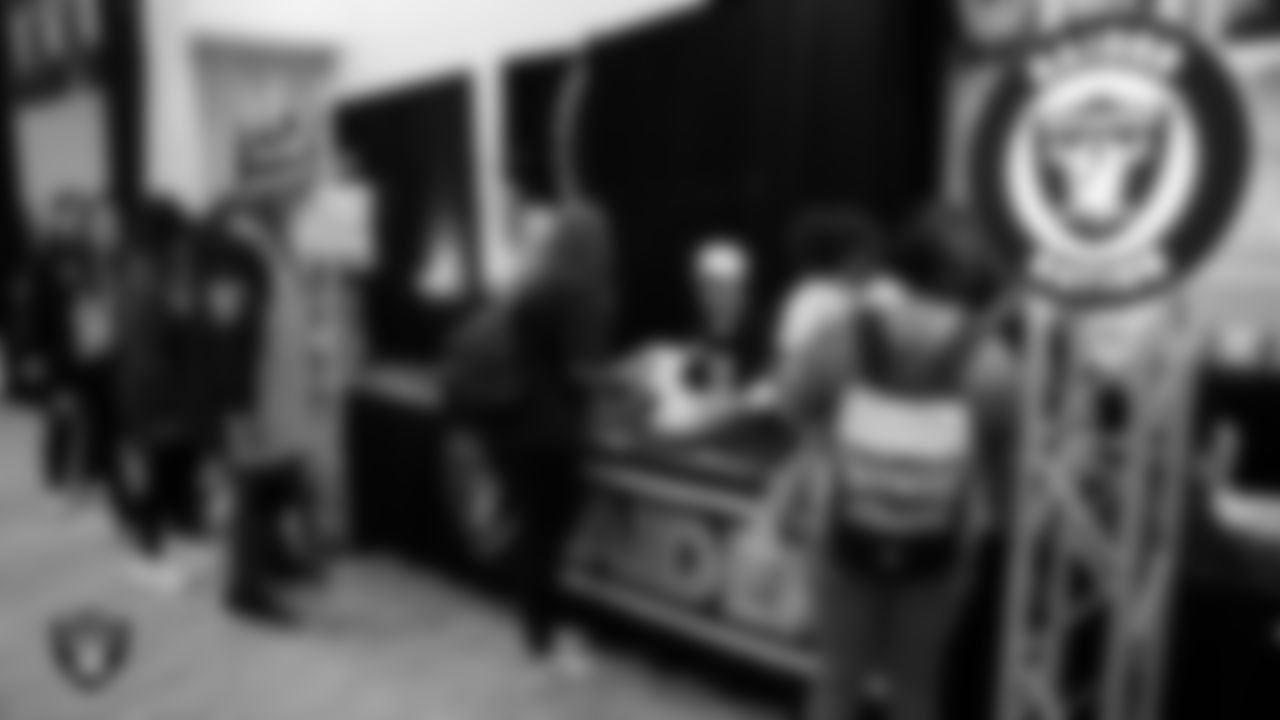 Las Vegas Raiders kicker Daniel Carlson (8) signs autographs for service members at Nellis Air Force Base.