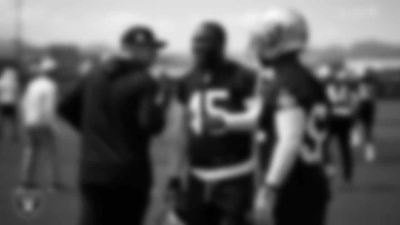 Las Vegas Raiders linebackers coach John Glenn and linebacker Devin White (45) at an Organized Team Activity (OTA) at Intermountain Health Performance Center.