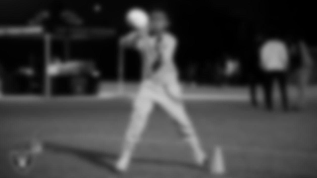 An athlete takes part in a Silver and Black League flag football clinic at Bill and Lillie Heinrich YMCA.