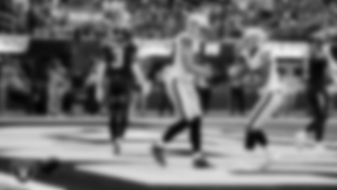 Las Vegas Raiders tight end Brock Bowers (89) celebrates with wide receiver Tyler Lockett (17) after making a 6-yard touchdown catch during the regular season away game against the Los Angeles Chargers at SoFi Stadium.