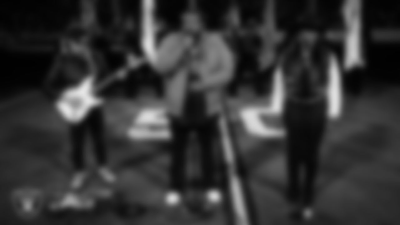 Musical duo The War and Treaty performs the national anthem while the Rancho High School Air Force JROTC Honor Guard presents the nation's colors before the Las Vegas Raiders' regular season home game against the Dallas Cowboys at Allegiant Stadium.