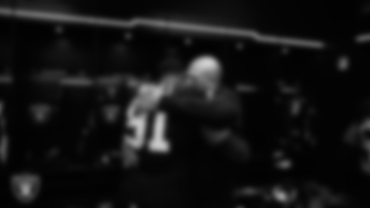 Las Vegas Raiders defensive tackle Bilal Nichols (91) and Interim Head Coach Antonio Pierce in the locker room after the regular season home game against the New York Giants at Allegiant Stadium.