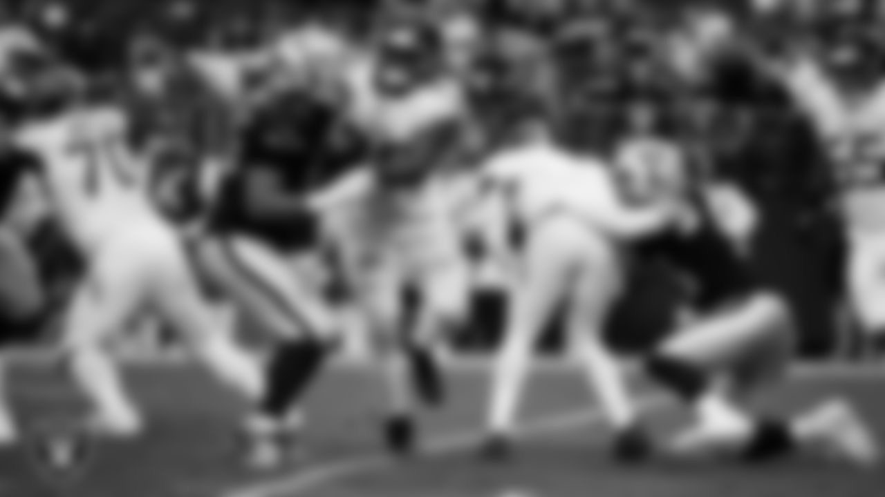 Las Vegas Raiders defensive end Maxx Crosby (98) sacks the quarterback during the regular season home game against the Tennessee Titans at Allegiant Stadium.