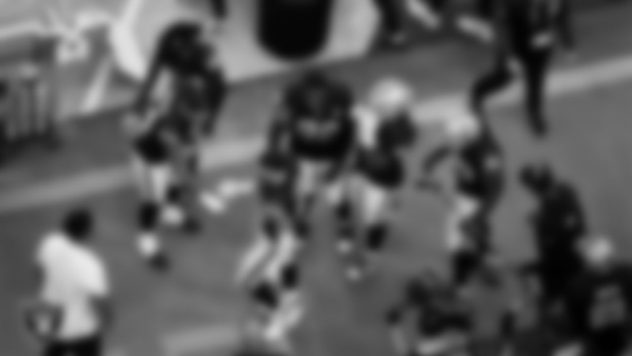 Las Vegas Raiders defensive end Maxx Crosby (98) celebrates with teammates after making an interception during the regular season home game against the Chicago Bears at Allegiant Stadium.