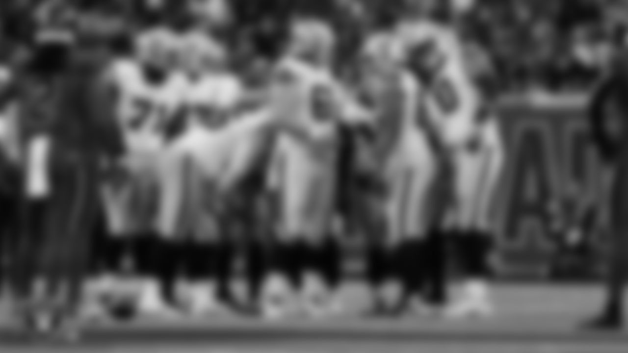 The Las Vegas Raiders huddle during the regular season away game against the Houston Texans at NRG Stadium.