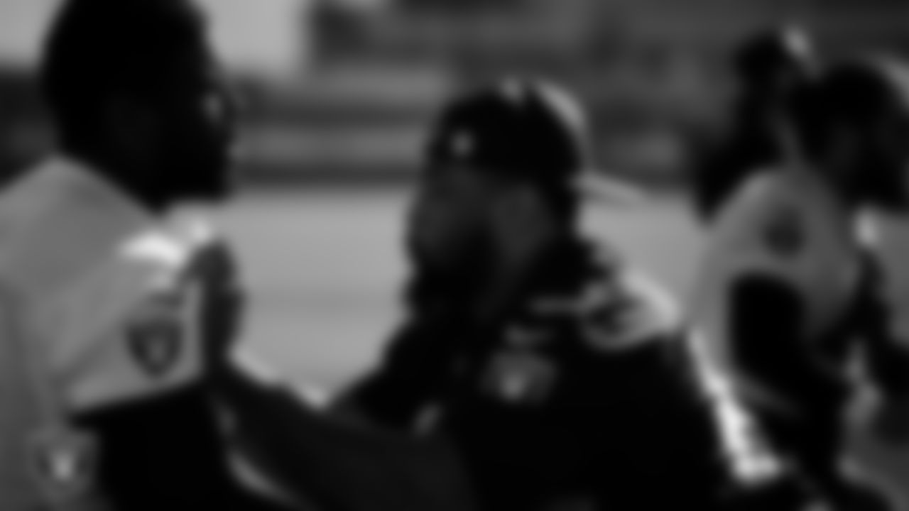 Las Vegas Raiders guard McClendon Curtis (63) and guard Layden Robinson (64) during practice at Intermountain Health Performance Center.