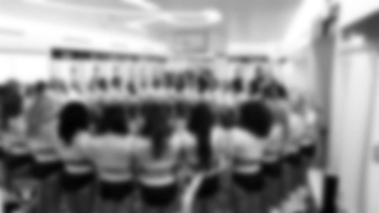The Raiderettes huddle in the locker room before the regular season home game against the Los Angeles Chargers at Allegiant Stadium.