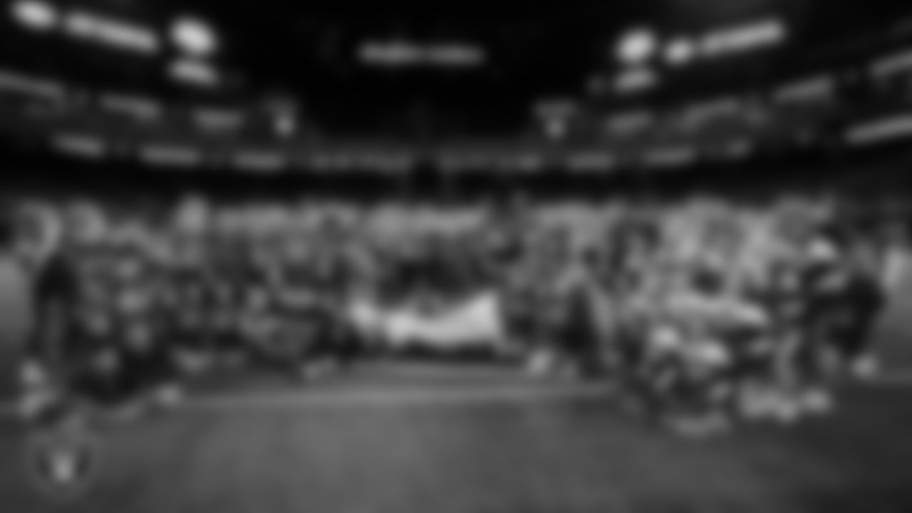 The Bishop Gorman High School football, cheer and dance teams pose for a photo after defeating Arbor View High School in the NIAA 5A Open Division State Championship game at Allegiant Stadium.