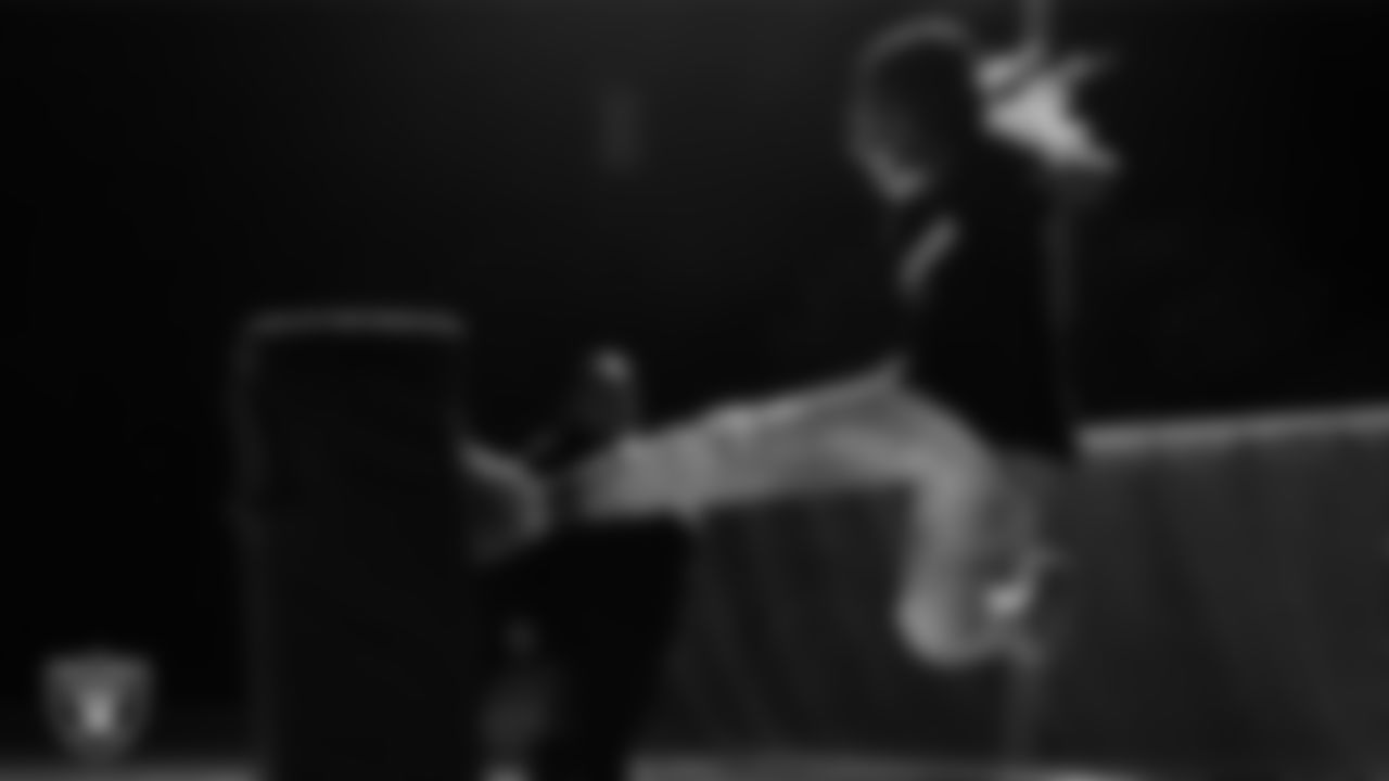 An athlete takes part in a Silver and Black League flag football clinic at Bill and Lillie Heinrich YMCA.