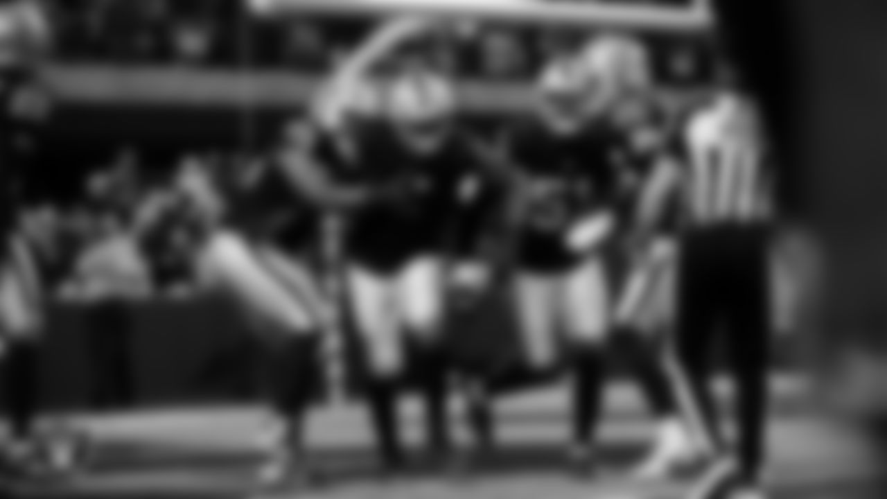 Las Vegas Raiders defensive end Tyree Wilson (9) celebrates with teammates after sacking the quarterback for a safety during the regular season home game against the Kansas City Chiefs at Allegiant Stadium.