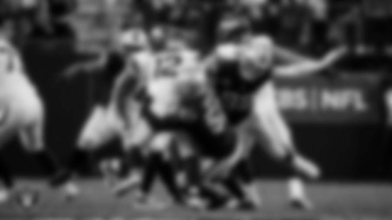 Las Vegas Raiders linebacker Elandon Roberts (52) makes a tackle during the regular season home game against the Denver Broncos at Allegiant Stadium.