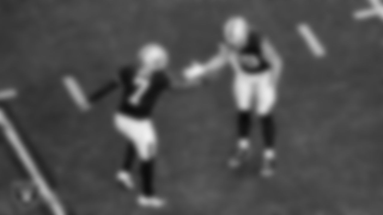 Las Vegas Raiders tight end Brock Bowers (89) celebrates with quarterback Geno Smith (7) after making a 15-yard touchdown catch during the regular season home game against the Denver Broncos at Allegiant Stadium.