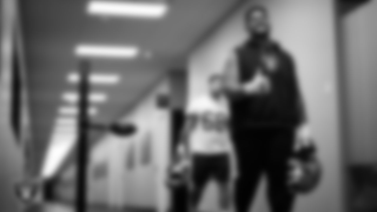 Las Vegas Raiders guard Atonio Mafi (56) walks out to the field for practice at Intermountain Health Performance Center.