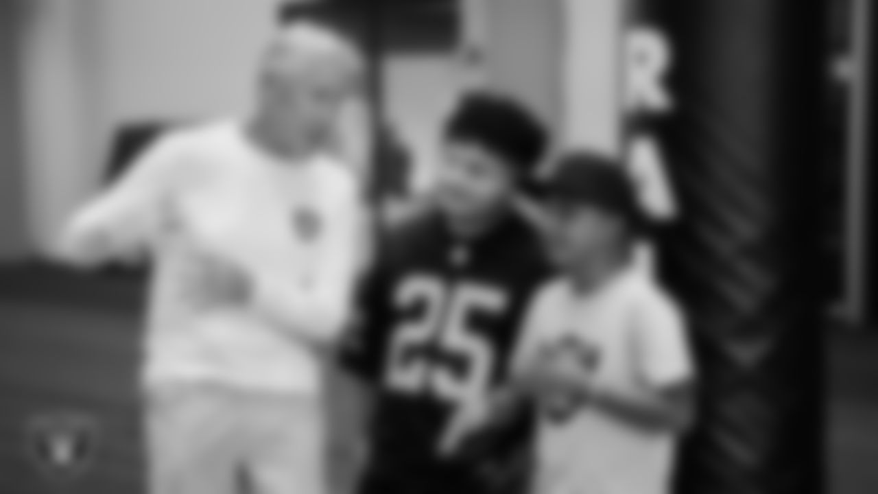 Las Vegas Raiders Head Coach Pete Carroll with Marcos Carrillo and Christopher Arias from Make-A-Wish during a visit to Intermountain Health Performance Center.