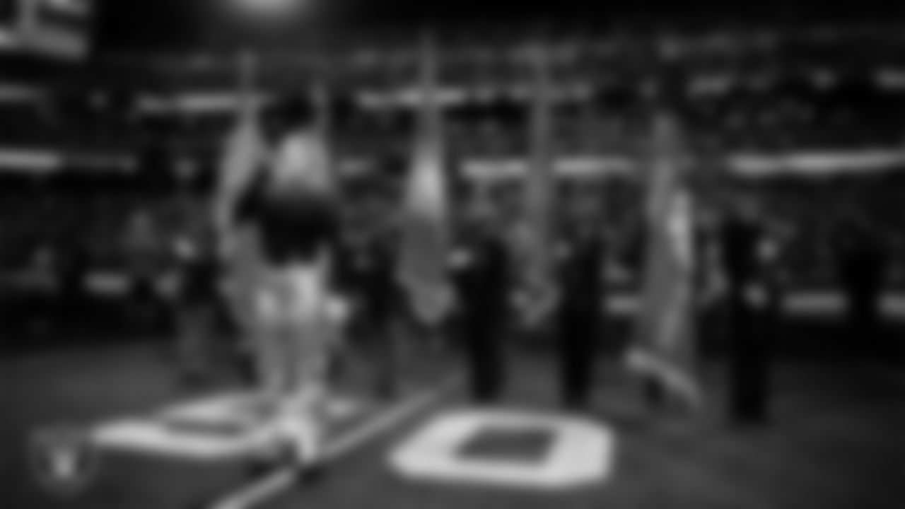 Singer and songwriter Joelle James performs the national anthem while Nevada First Responders present the nation's colors before the Las Vegas Raiders' regular season home game against the New York Giants at Allegiant Stadium.