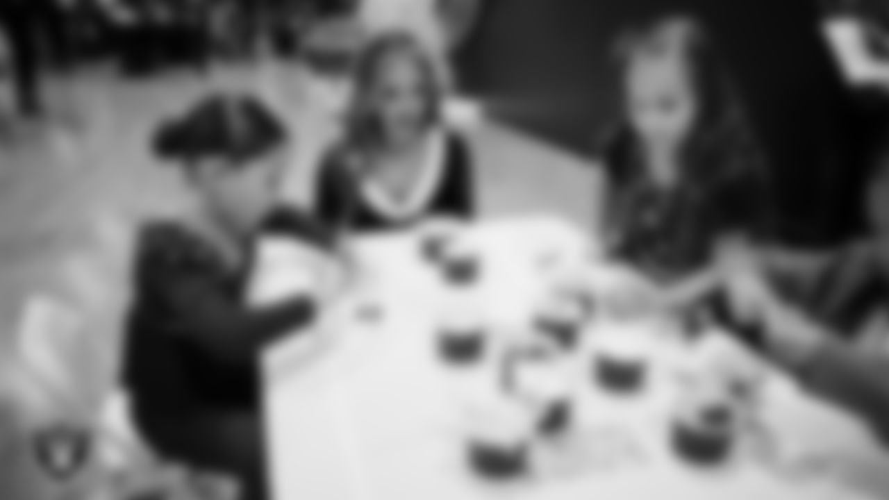 Raiderette Shelby and Junior Raiderettes enjoy activities during the Junior Raiderettes Banquet at The Studio.