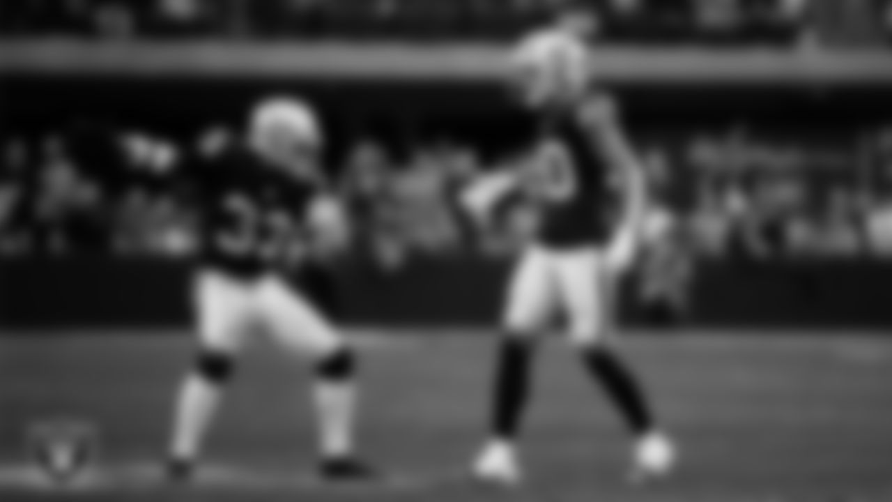 Las Vegas Raiders safety Isaiah Pola-Mao (20) celebrates with linebacker Jamal Adams (33) after breaking up a pass during the regular season home game against the New York Giants at Allegiant Stadium.