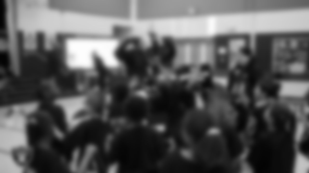 Raider Rusher with students during a pep rally at Matt Kelly Elementary School.