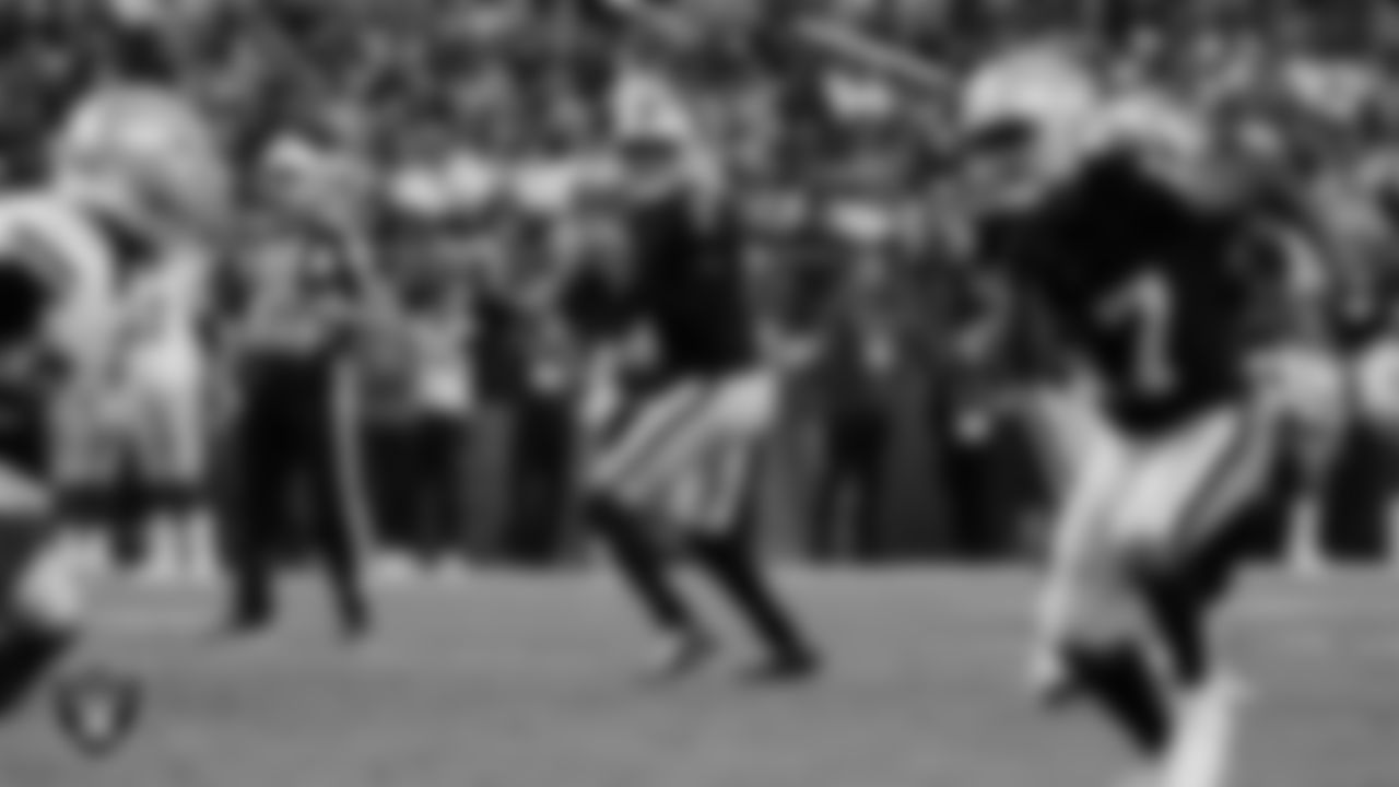 Las Vegas Raiders quarterback Geno Smith (7) looks for a receiver during the regular season home game against the Dallas Cowboys at Allegiant Stadium.