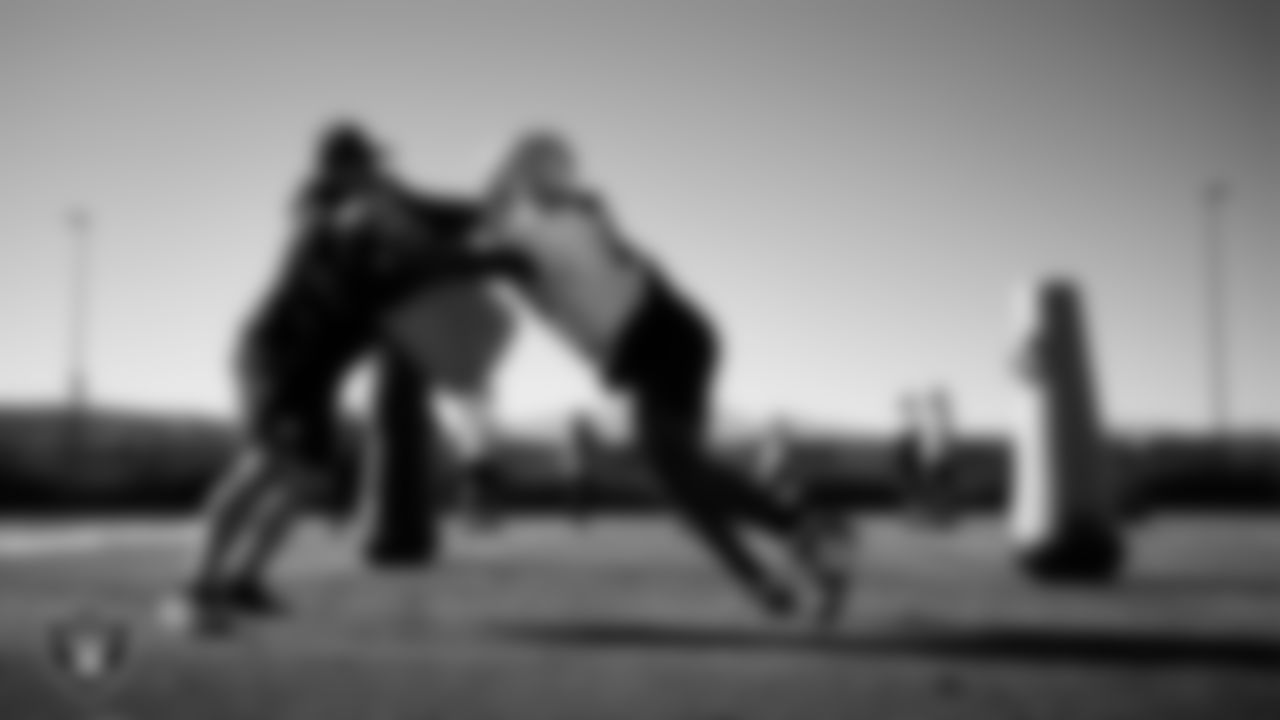 Las Vegas Raiders defensive assistant Rip Rowan and defensive tackle Adam Butler (69) during practice at Intermountain Health Performance Center.