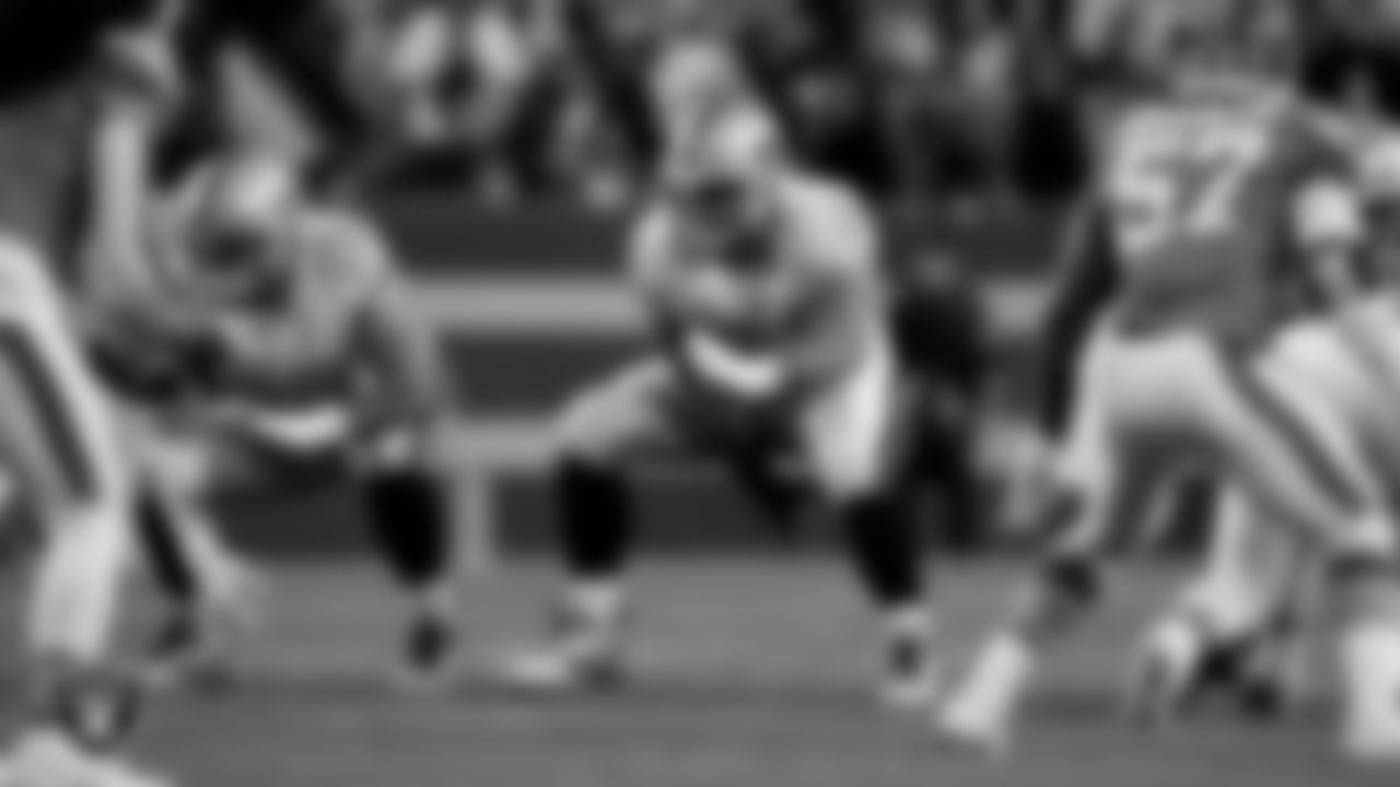 Las Vegas Raiders guard/center Jackson Powers-Johnson (58) and center/guard Jordan Meredith (61) during the regular season away game against the Denver Broncos at Empower Field at Mile High.