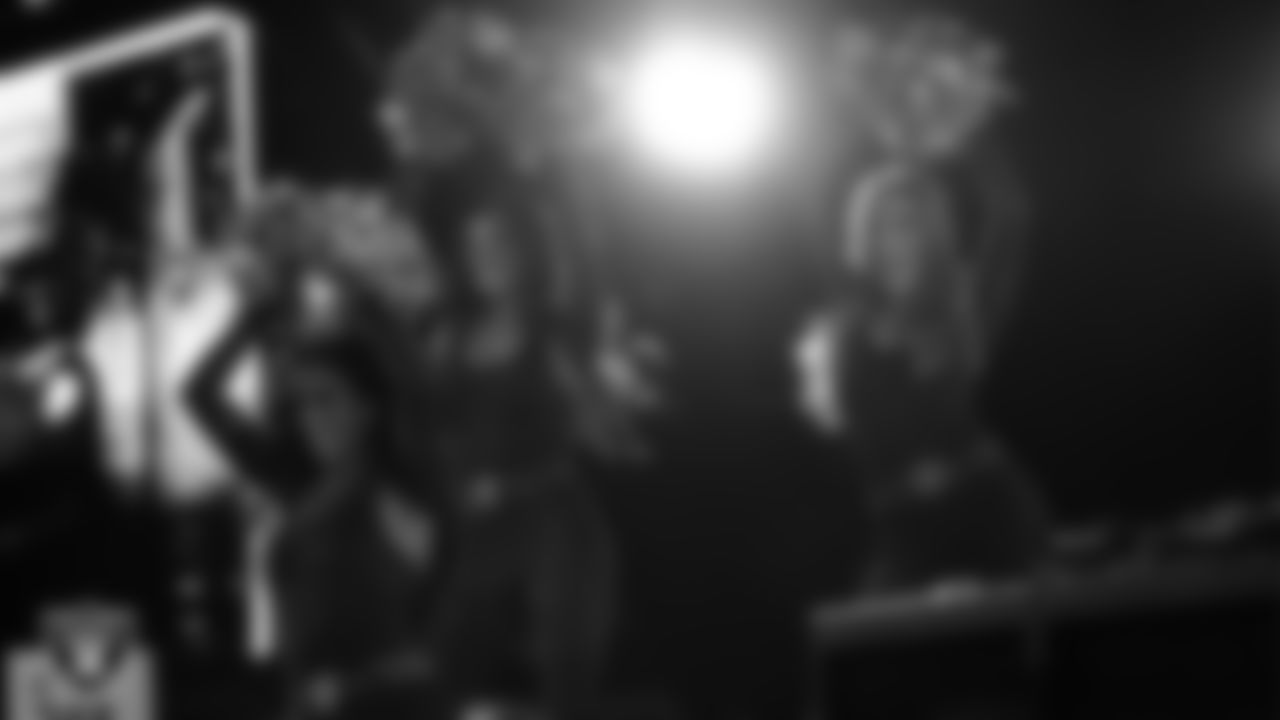 Raiderettes Cheyanne and Madisyn perform with Rapper Nelly at halftime during the regular season home game against the Dallas Cowboys at Allegiant Stadium.