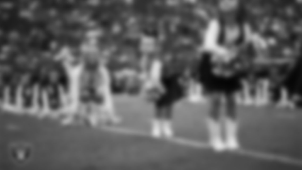 Raiderette Delaney and Junior Raiderettes perform on the field before the preseason home game against the San Francisco 49ers at Allegiant Stadium.