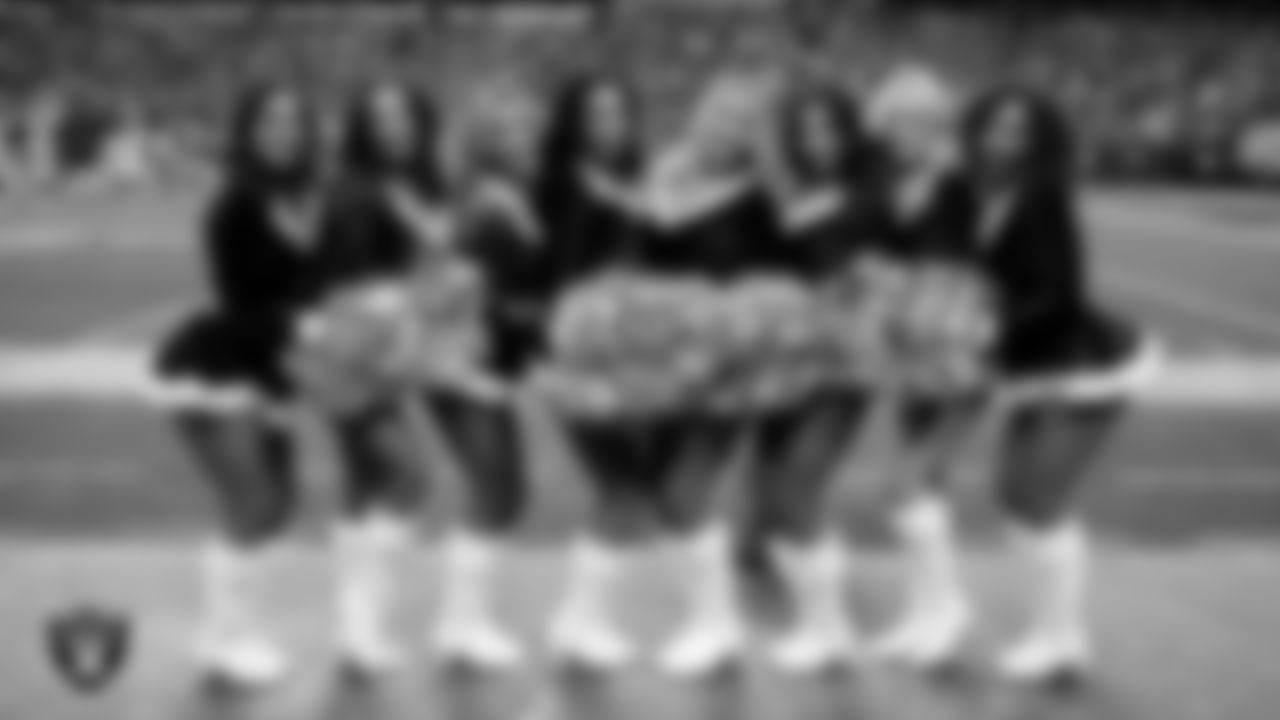 Line 3 of the Raiderettes pose for a photo on the sidelines during the regular season home game against the New York Giants at Allegiant Stadium.