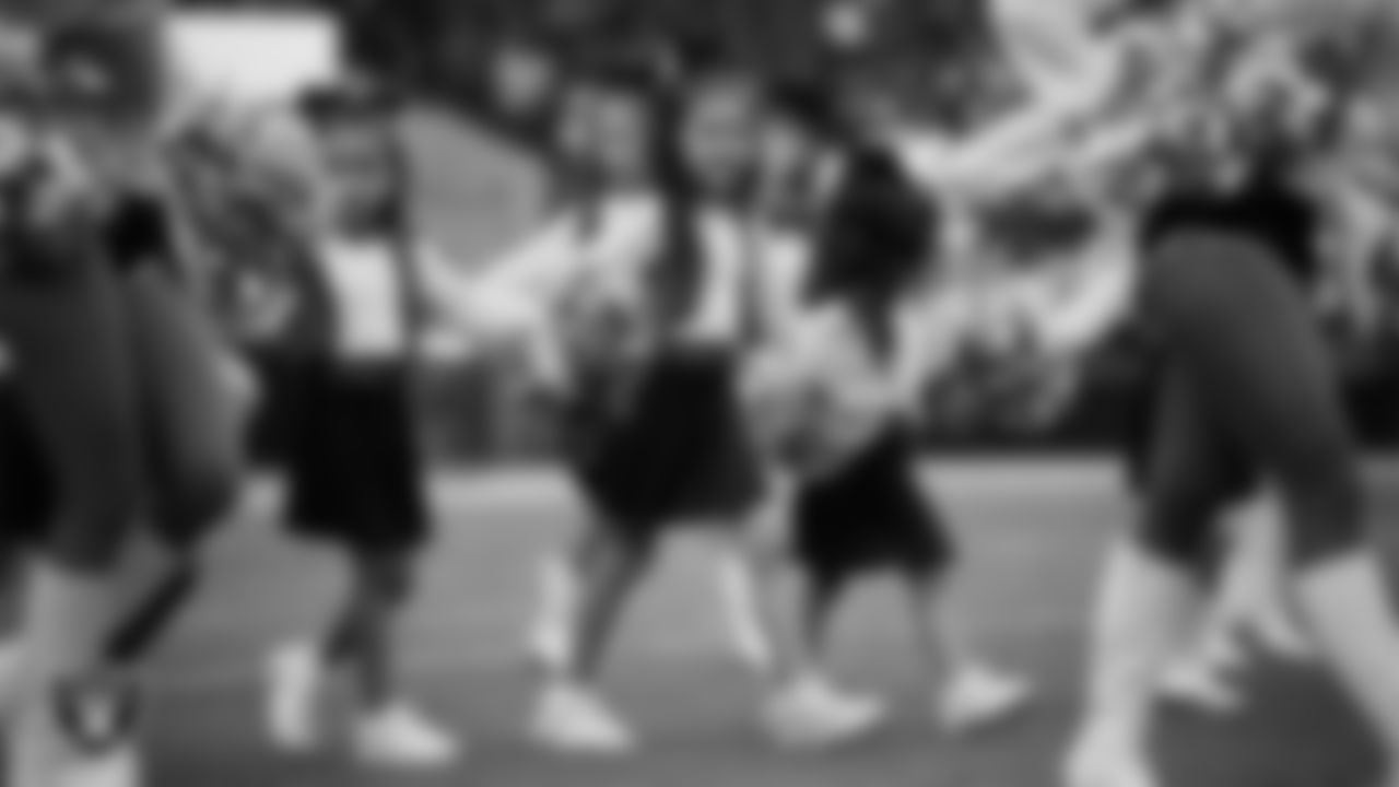 Junior Raiderettes enter the field for their performance on the field before the preseason home game against the San Francisco 49ers at Allegiant Stadium.