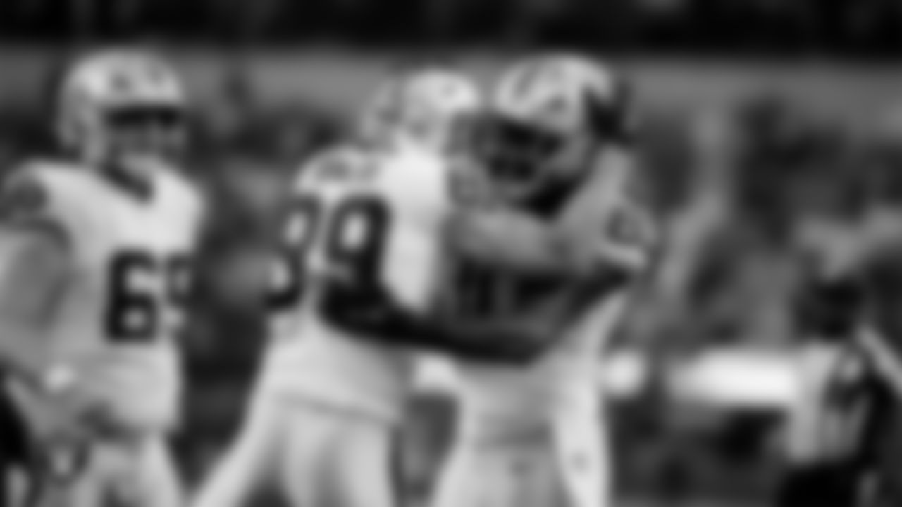 Las Vegas Raiders tight end Brock Bowers (89) celebrates with tight end Ian Thomas (80) after making a 6-yard touchdown catch during the regular season away game against the Los Angeles Chargers at SoFi Stadium.