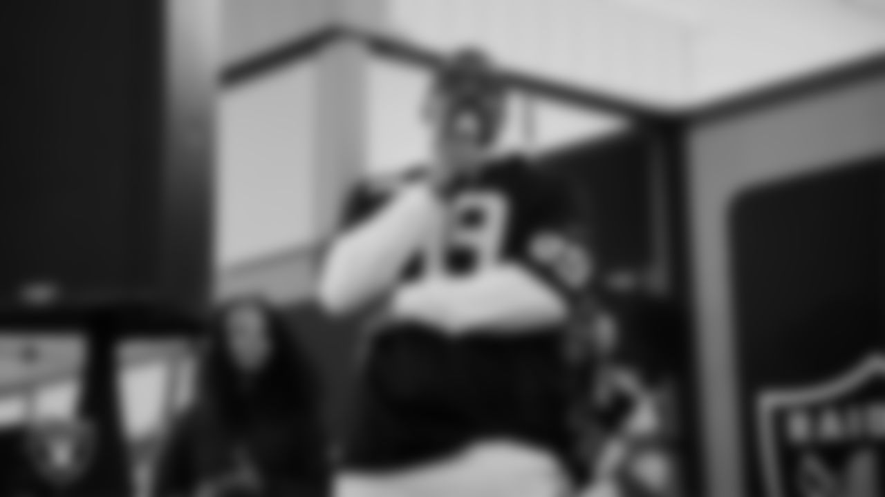 Las Vegas Raiders defensive tackle Thomas Booker IV (99) speaks during the Raiders Holiday Salute at Nellis Air Force Base - Coral Academy.