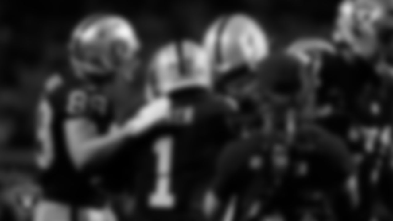 Las Vegas Raiders wide receiver Tre Tucker (1) celebrates with teammates after making a 6-yard touchdown catch during the regular season home game against the Dallas Cowboys at Allegiant Stadium.