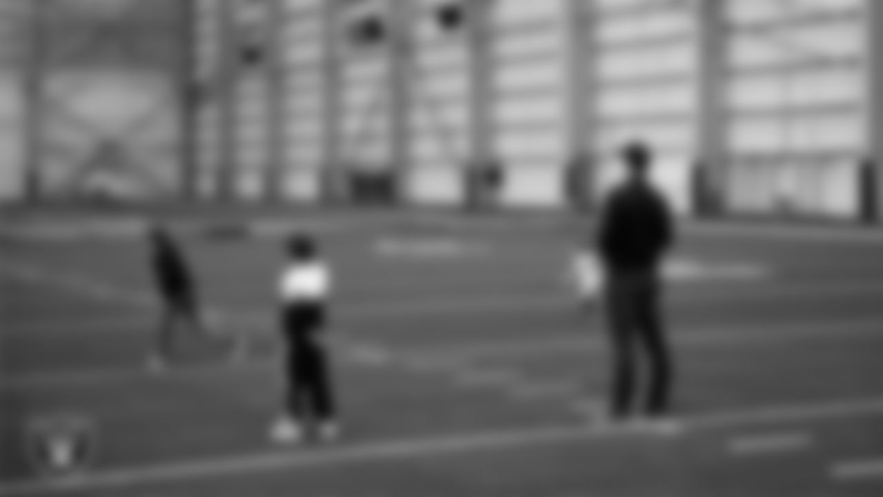 Las Vegas Raiders Head Coach Klint Kubiak and his family on the indoor field at Intermountain Health Performance Center.