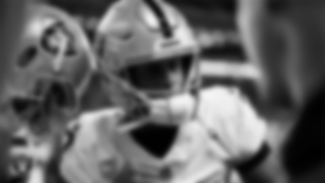 Las Vegas Raiders quarterback Geno Smith (7) in a huddle before the regular season away game against the Indianapolis Colts at Lucas Oil Stadium.