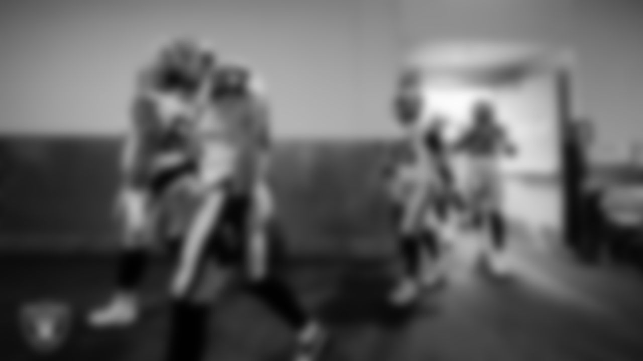 The Las Vegas Raiders walk down the tunnel before the regular season away game against the Los Angeles Chargers at SoFi Stadium.