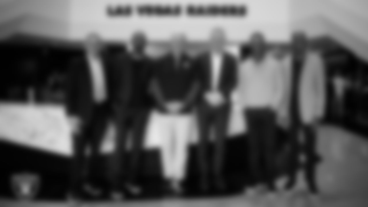 Las Vegas Raiders alumni Jim Plunkett, Charles Woodson, Rich Gannon, Howie Long, Marcus Allen and Mike Haynes pose for a photo before welcoming Raiders Head Coach Klint Kubiak to Intermountain Health Performance Center.