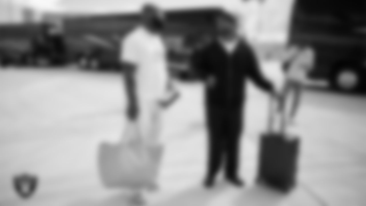 Las Vegas Raiders linebacker Germaine Pratt (57) and linebacker Elandon Roberts (52) depart for the regular season away game against the Washington Commanders.