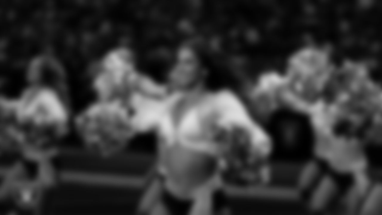 Raiderette Raegen walks onto the field for a performance during the regular season home game against the Denver Broncos at Allegiant Stadium.