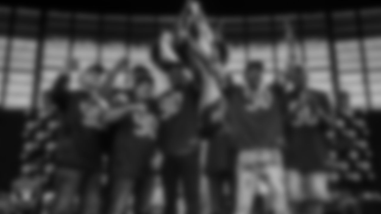 The 1990 UNLV Runnin' Rebels National Championship Team lights the Al Davis Memorial Torch before the Las Vegas Raiders' regular season home game against the Jacksonville Jaguars at Allegiant Stadium.