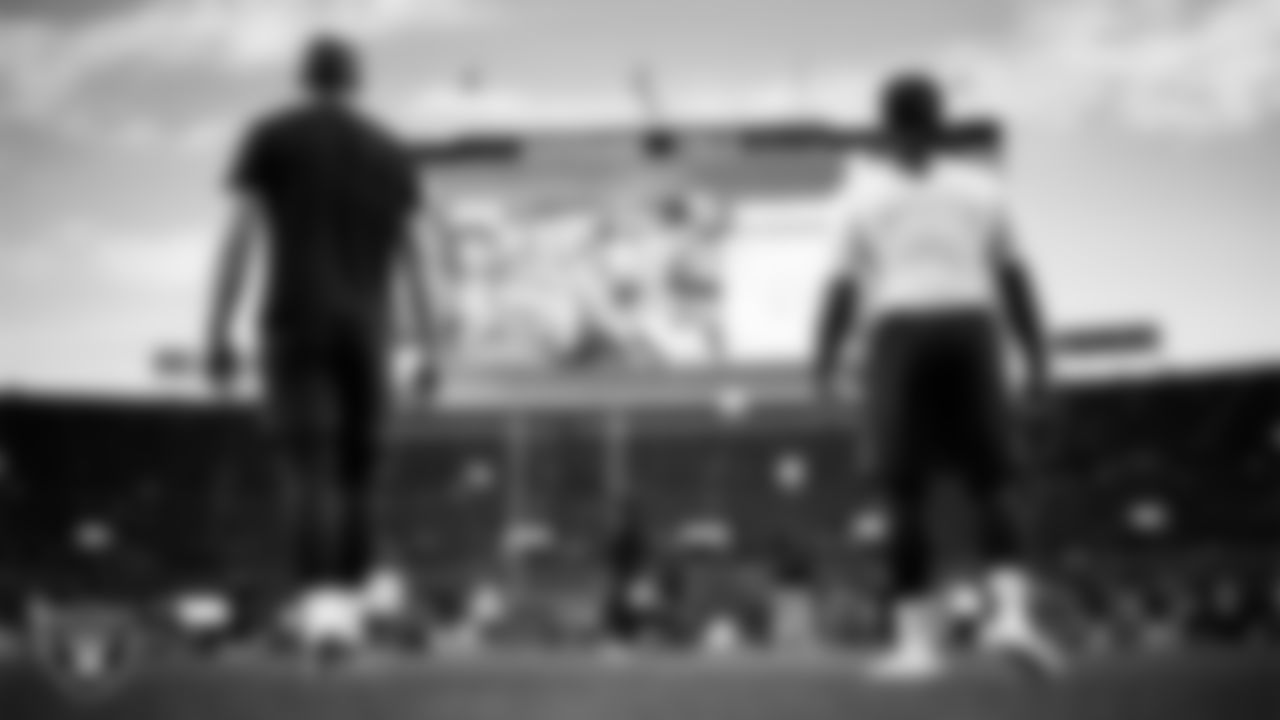 Las Vegas Raiders tight end Brock Bowers (89) and running back Ashton Jeanty (2) warming up before the regular season away game against the Denver Broncos at Empower Field at Mile High.